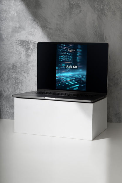Laptop on a white stand with a dark screen displaying 'Luma Pathway' against a gray concrete wall.