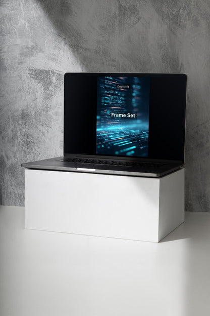 Laptop on a white stand with a dark screen displaying 'Luma Pathway' against a gray concrete wall.